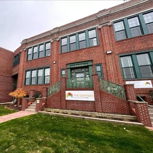 A brick building with a lawn Description automatically generated, Picture